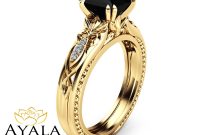 the-enigmatic-embrace-black-diamond-and-yellow-gold-engagement-rings